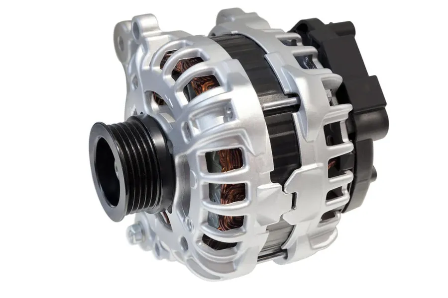 A photo of a car alternator, highlighting its pulley and housing.