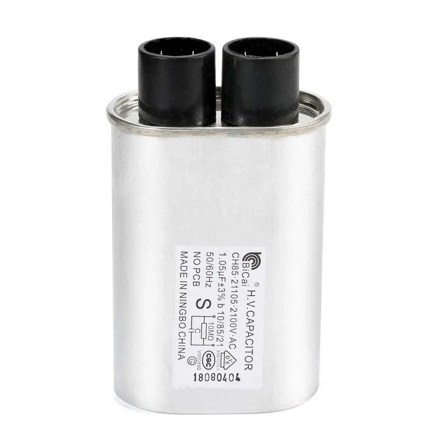 A high voltage capacitor with warning labels.
