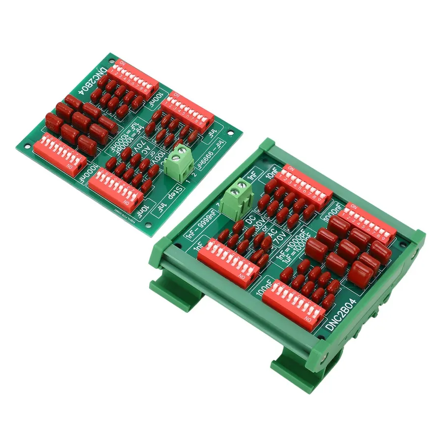 A circuit board with several 10nF capacitors soldered onto it.