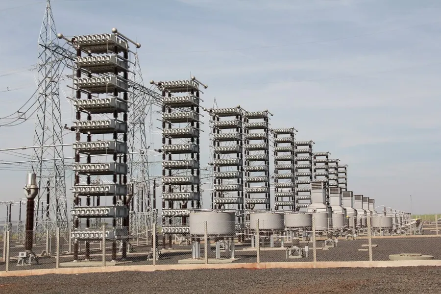 High voltage capacitors installed in a power substation.
