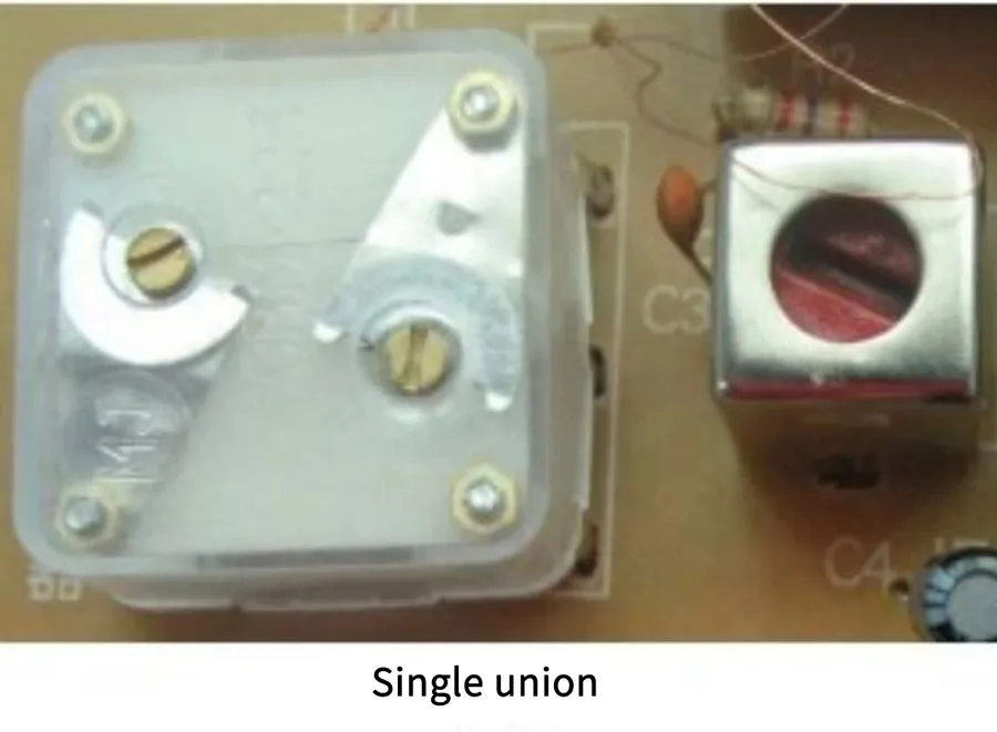 A trimmer capacitor on a circuit board in an application.