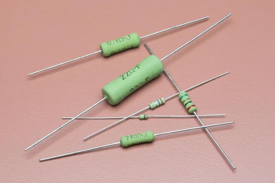 Various leaded KOA resistors with different colors and sizes.