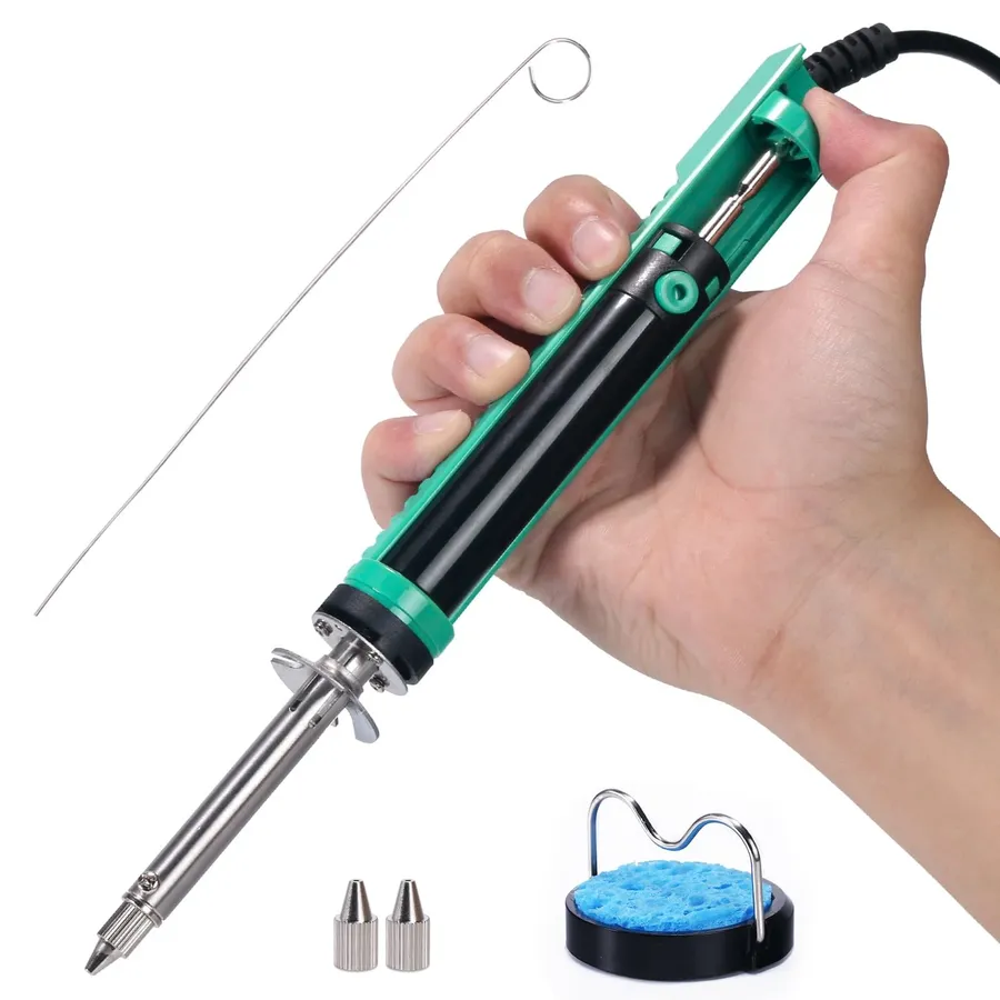 A set of tools used for desoldering and soldering capacitors on a motherboard.