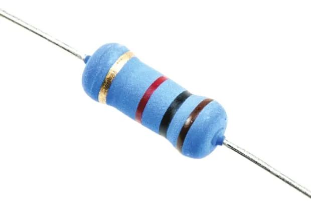 Various types of resistors laid out on a table.