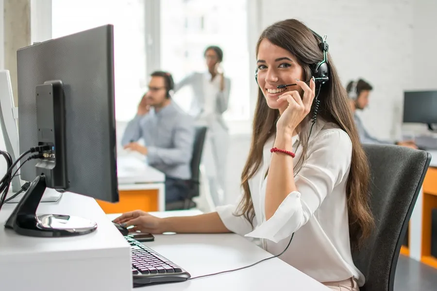A customer service representative assisting a customer over the phone.