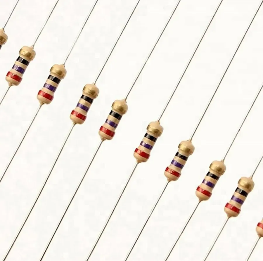 A close up of ceramic resistor showing color code bands.