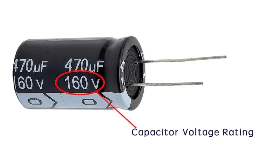 A selection of capacitors, each with different voltage ratings labeled on their casing.