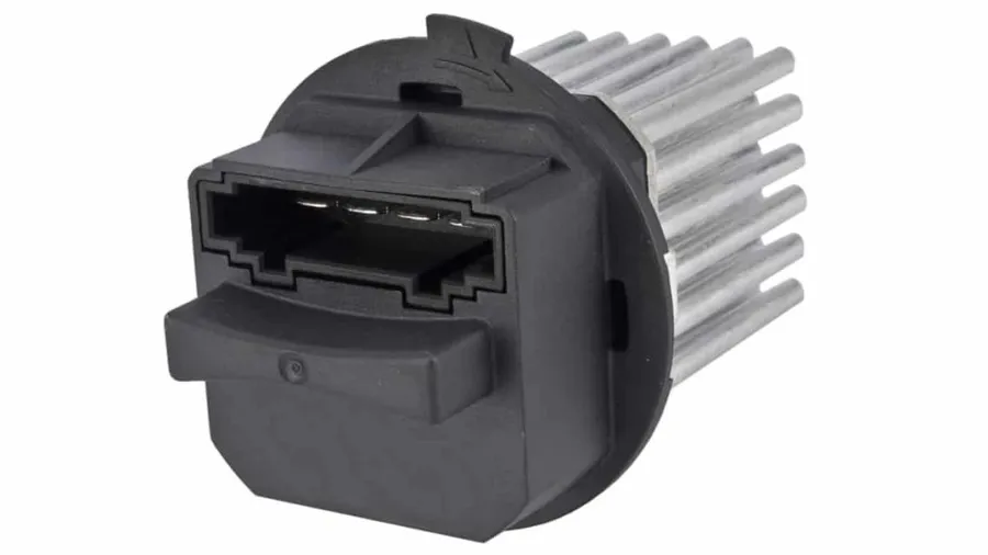 A car blower motor resistor installed in the blower motor assembly.
