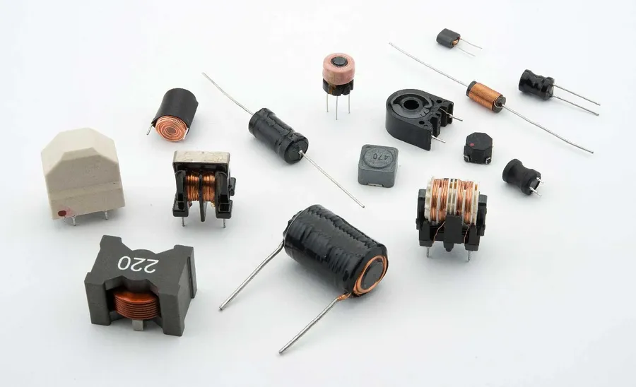A selection of different inductors, including toroidal and coil types.