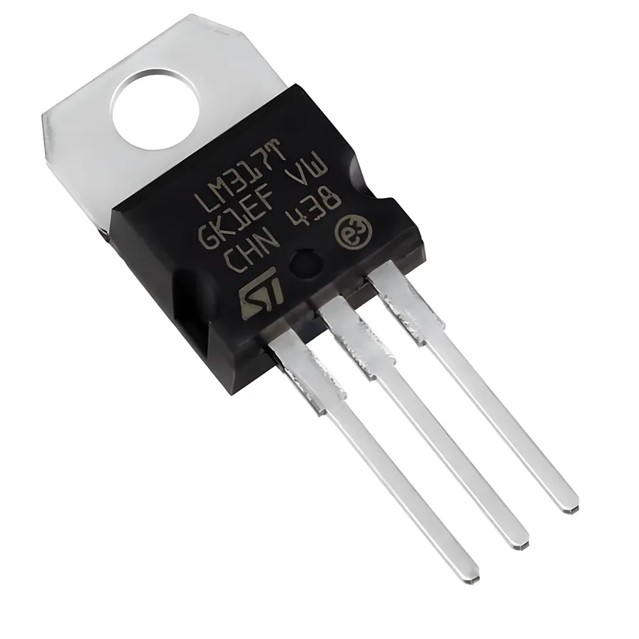 A close-up view of an LM317 voltage regulator chip.