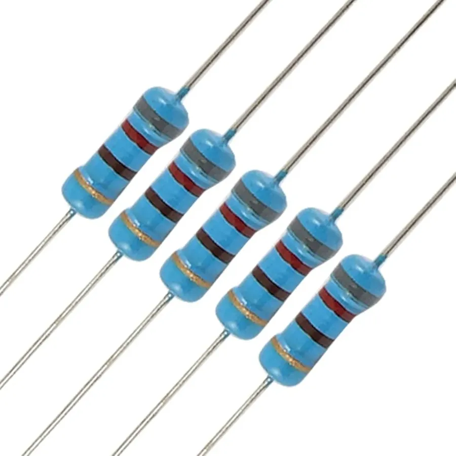 A person using tweezers to replace a resistor on a circuit board.