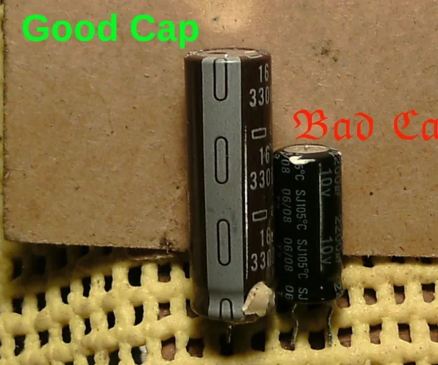 A close-up view of a bulging and damaged capacitor.