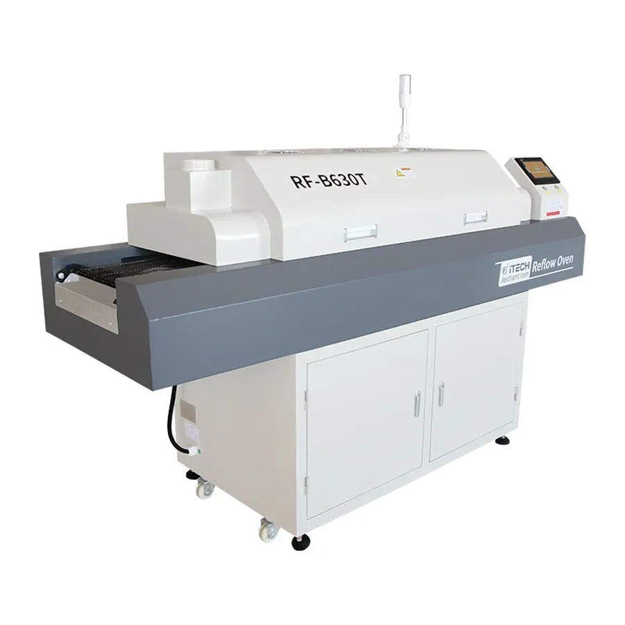A PCB being soldered through a reflow oven.