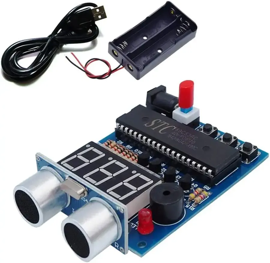 An electronic kit being assembled on a workbench.