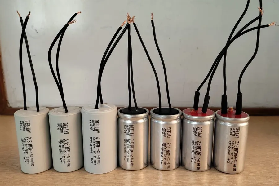 Various types of capacitors commonly used in ceiling fans.