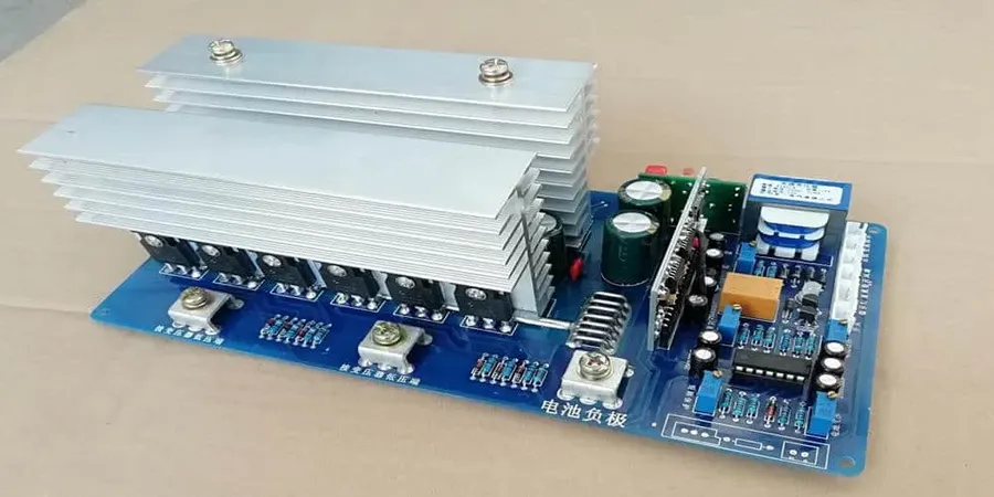 An inverter circuit board powering a small electronic device in a car, demonstrating a practical use.