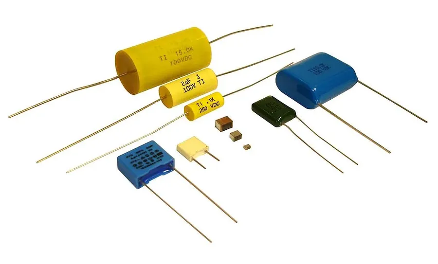 A film capacitor with its characteristic flat, rectangular body.
