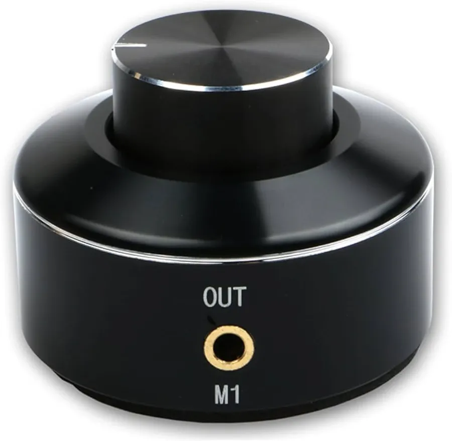 A control knob on an audio device being adjusted.