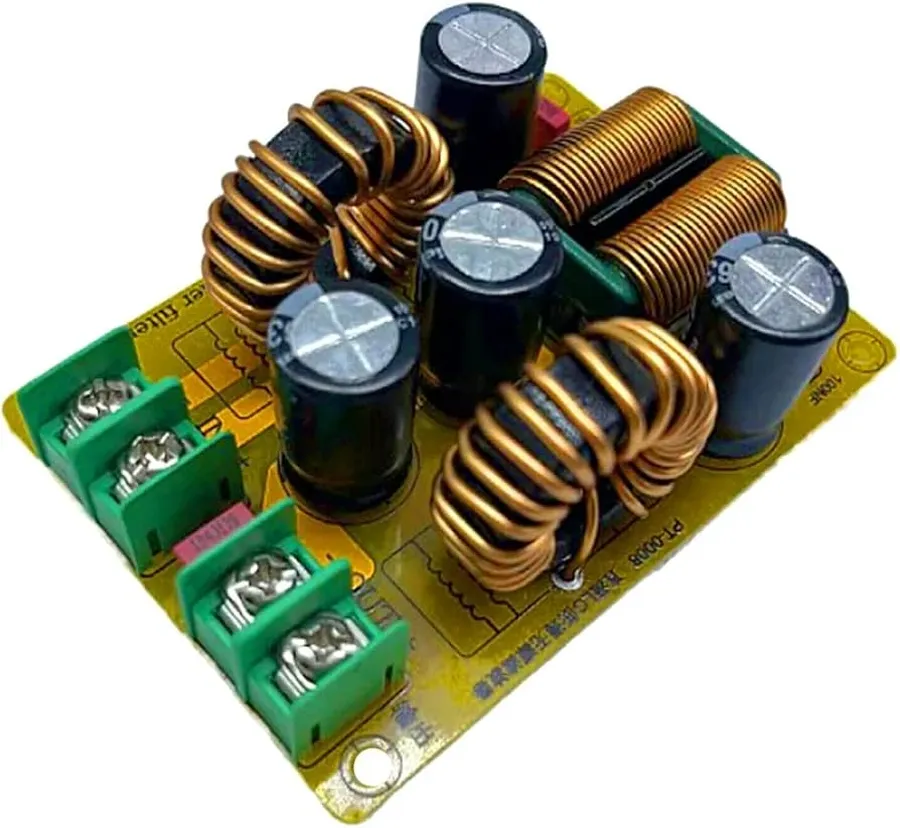 An audio amplifier circuit board with a DC filter component.