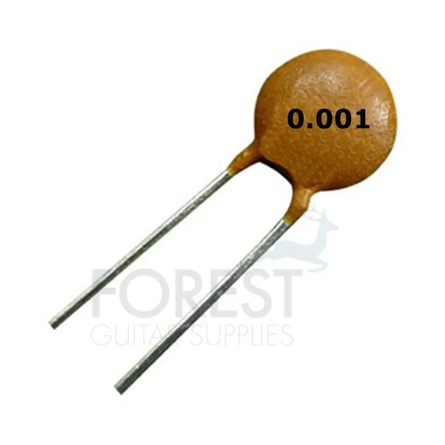 A close-up of ceramic disc capacitors used in a guitar.