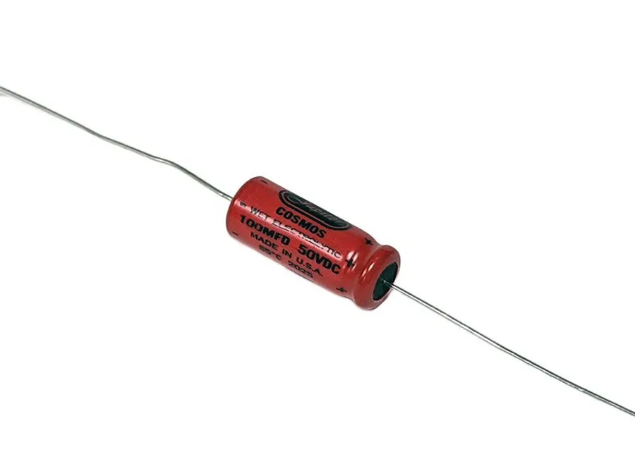 A detailed close-up of an axial electrolytic capacitor showing its structure.