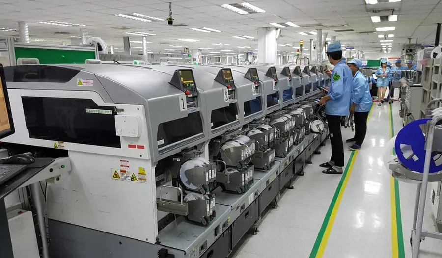 A production line showcasing various stages of electronics assembly.