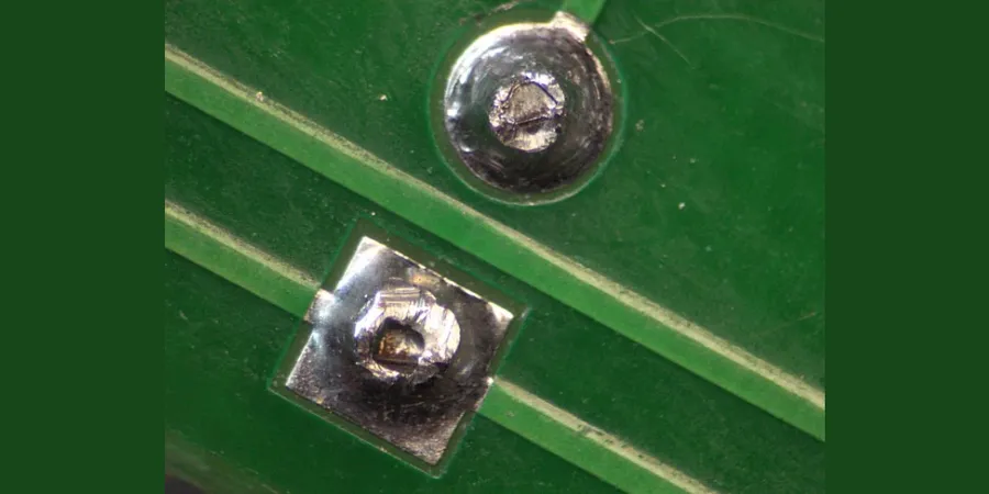 A close up image of a solder joint on a PCB