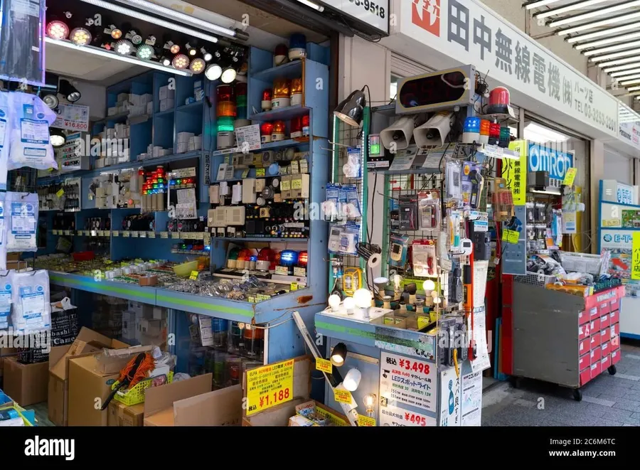 A storefront of an electronic components store with shelves of various parts.