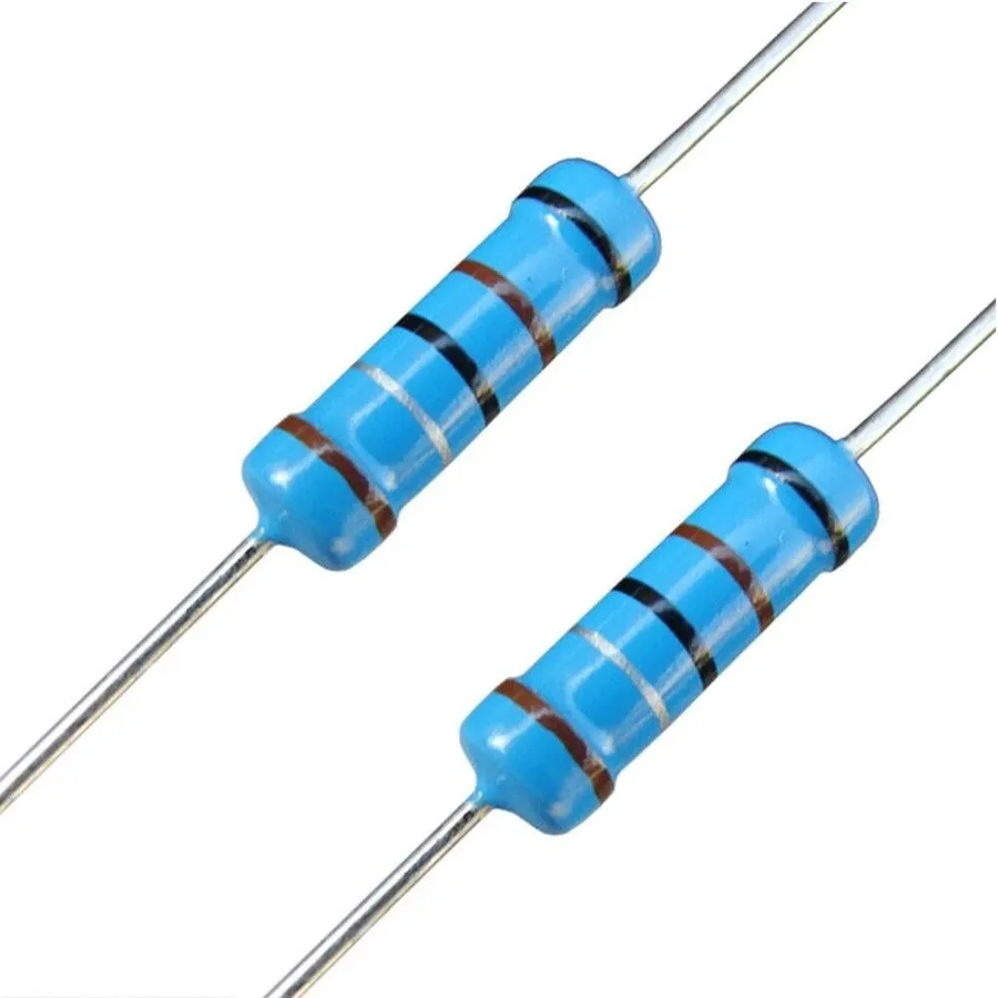 A 1/4 watt resistor next to a ruler for size comparison.