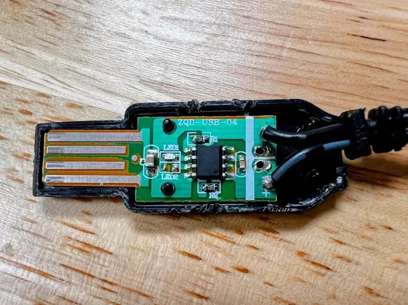Internal view of a shared charger showing the PCB board