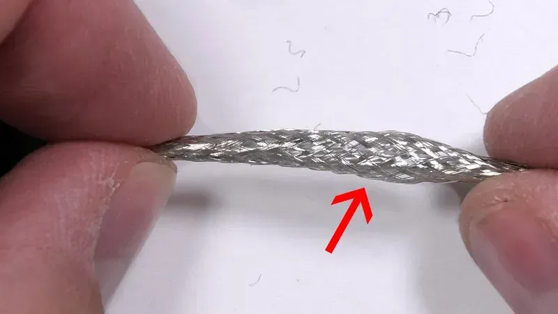 A shared charging cable undergoing a durability test