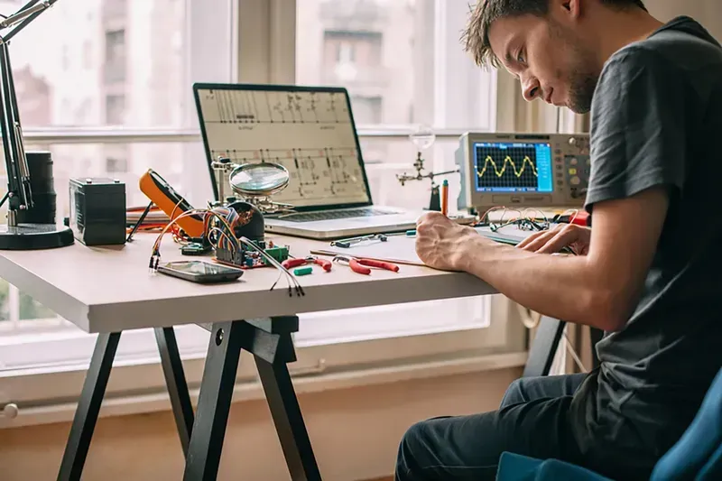 An engineer working on an electronic device