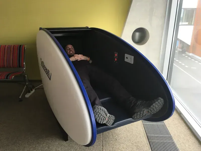Sleep pods installed in a busy airport lounge