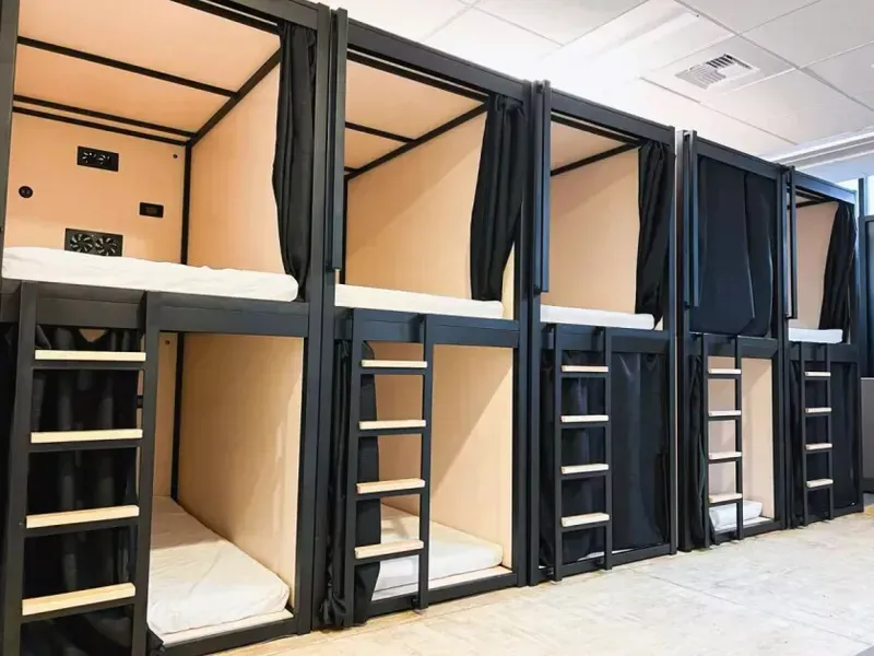 A modern shared sleep pod with ergonomic interior