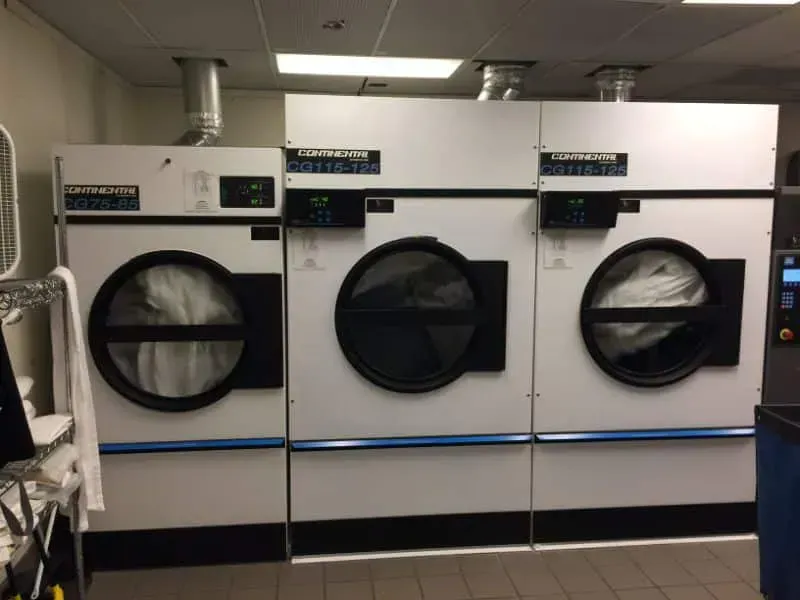 Laundry room with a dryer in a hotel