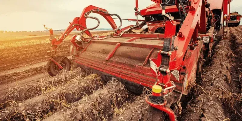 Shared agricultural machinery being used in a field