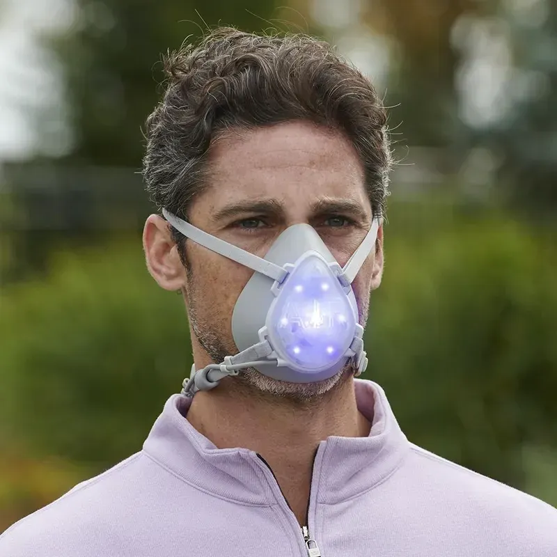 A UV sterilizer being used to sterilize a mask