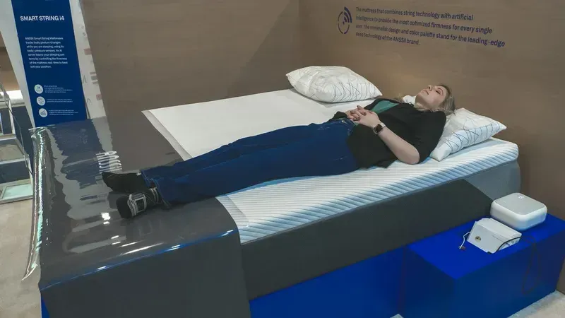 A person adjusting a smart mattress for comfort