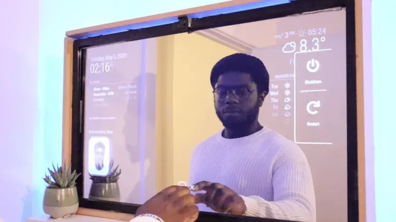 A smart mirror displaying information in a shared restroom.