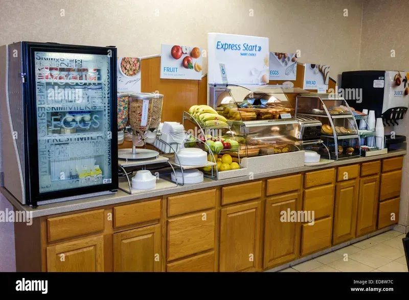 Shared breakfast cabinet in a hotel setting.