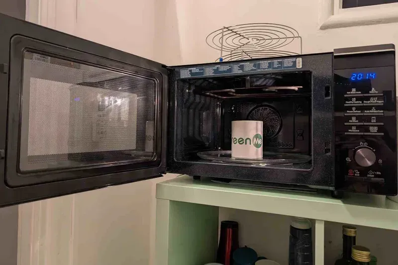 A shared microwave oven in an office break room.