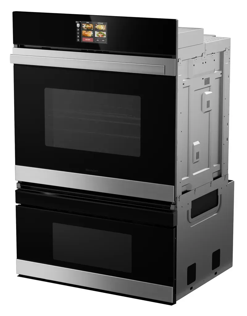 A shared microwave oven in a communal space.