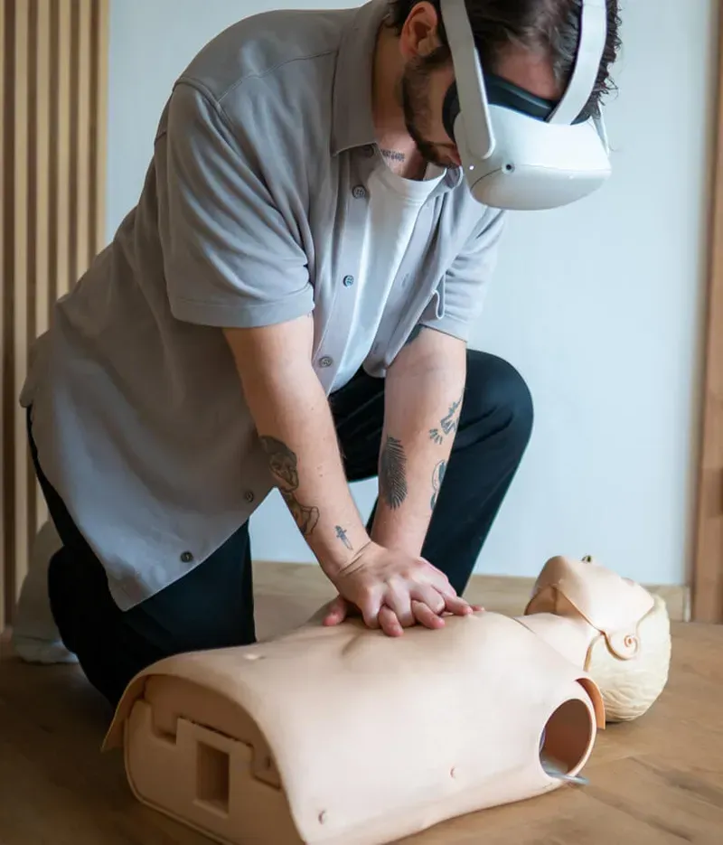 A person using VR for CPR training simulation.
