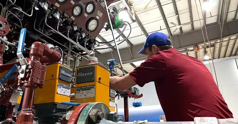 An engineer maintaining an industrial boiler