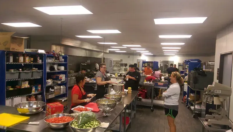 A shared kitchen space with multiple cooking stations.