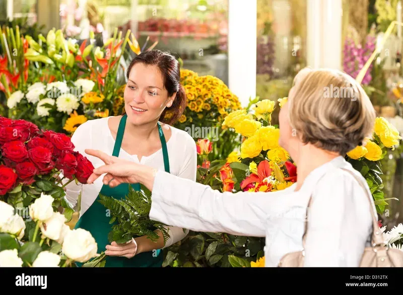 A customer selecting flowers from a self-service flower vending machine