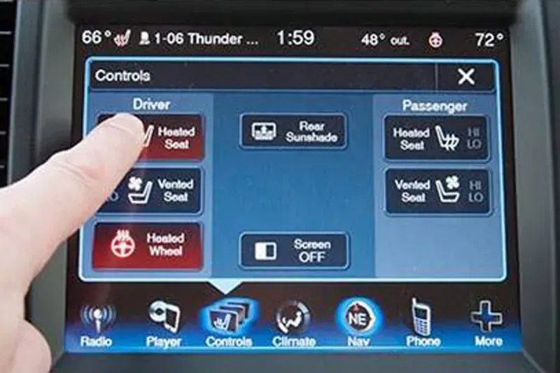 A close-up of a car seat heating control unit
