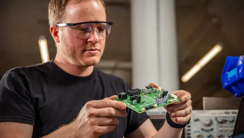 An engineer working on a PCB schematic design