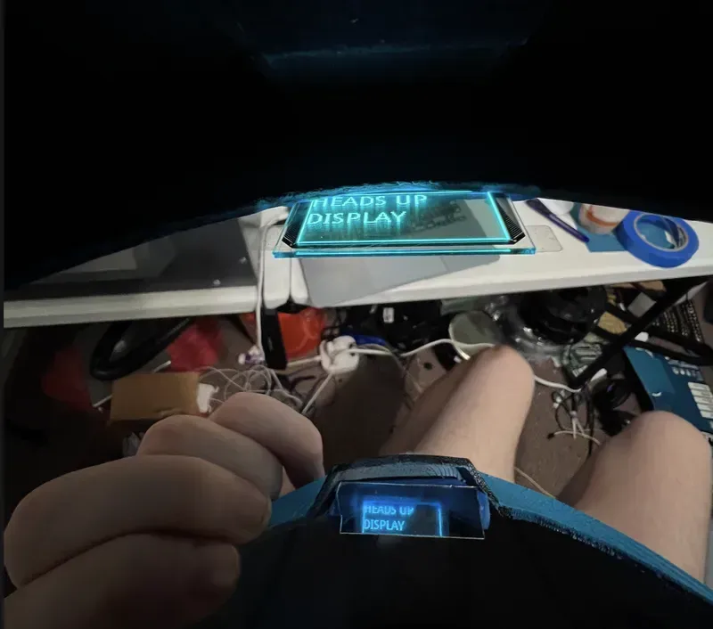 Internal view of a car Head-Up Display (HUD) showing its complex PCB