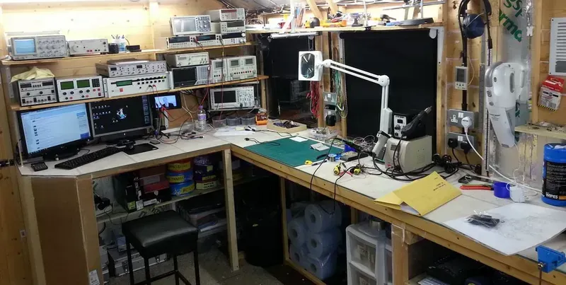 An engineer working on PCB design at a workbench